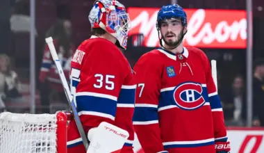 Montreal Canadiens center Kirby Dach (77) discusses with goalie Samuel Montembeault (35) against the Ottawa Senators during the second period at Bell Centre.