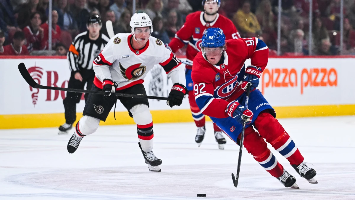 Montreal Canadiens right wing Patrik Laine (92) plays the puck against Ottawa Senators center Shane Pinto (12) during the first period at Bell Centre.