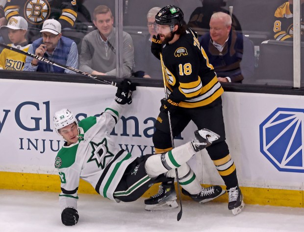 Boston Bruins center Pavel Zacha levels Dallas Stars center Wyatt Johnston as the Bruins take on the Stars at TD Garden this past season. (staff photo by Stuart Cahill/MNG)