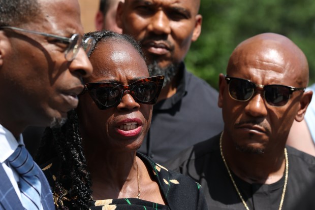 State Rep. Carol Ammons speaks with the media outside the Urbana federal courthouse on July 16, 2026. She and her husband, Champaign County Clerk Aaron Ammons, right, pleaded not guilty to federal charges. (Antonio Perez/Chicago Tribune)