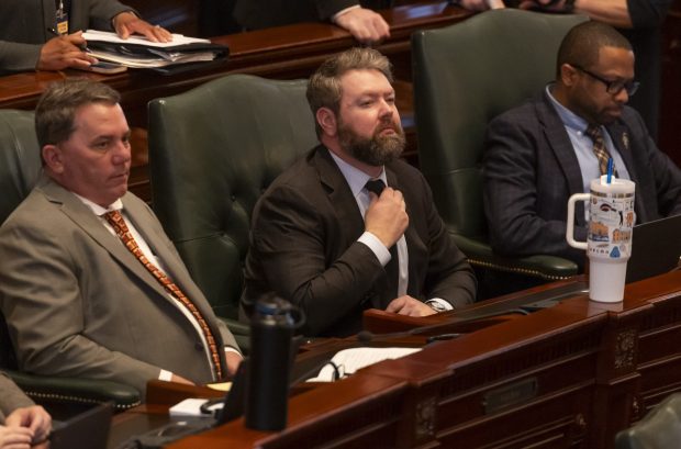 State Rep. Harry Benton, D-Plainfield, center, sits in the House chamber as lawmakers discuss bills at the Illinois State Capitol on April 8, 2026. (Eileen T. Meslar/Chicago Tribune)