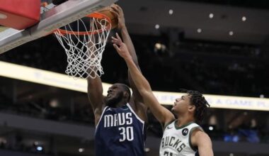 Moussa Cissé dunks for the Dallas Mavericks against the Milwaukee Bucks.