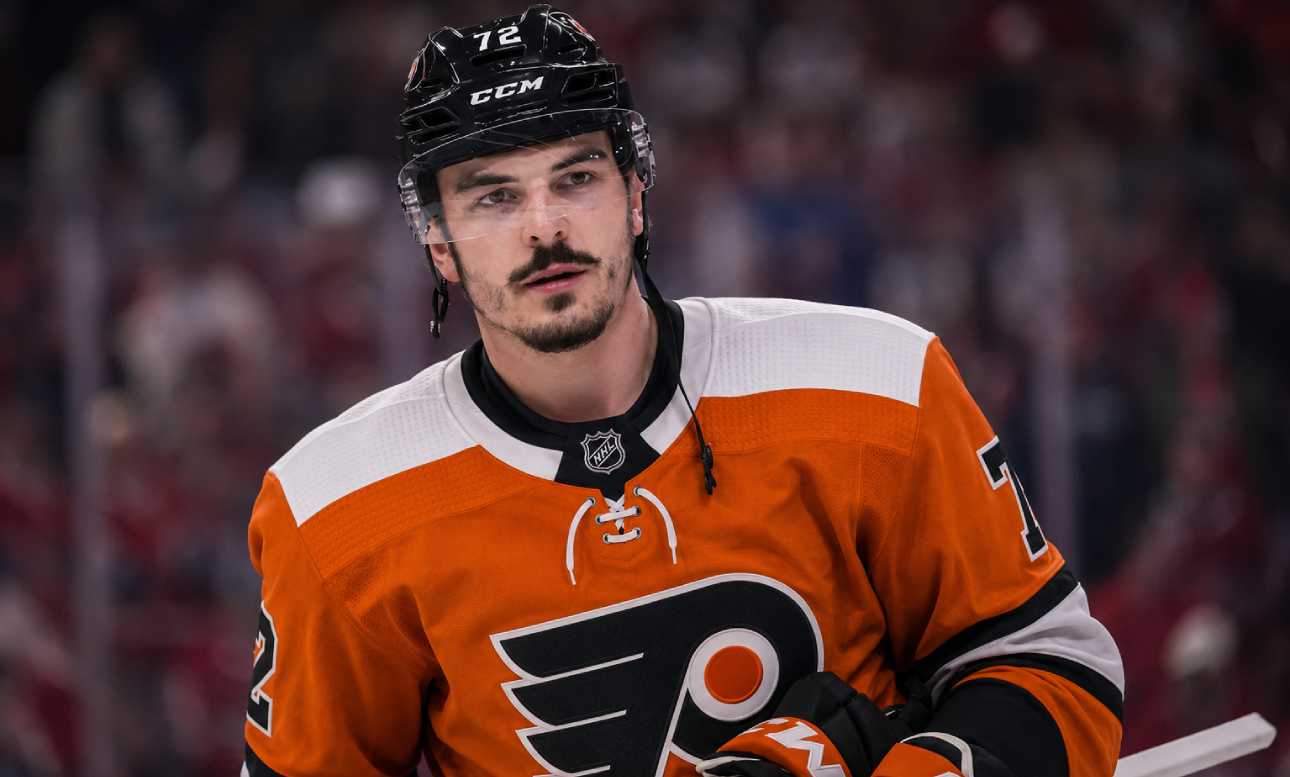 Arber Xhekaj wearing a Philadelphia Flyers home jersey amid NHL trade rumors involving the Montreal Canadiens.