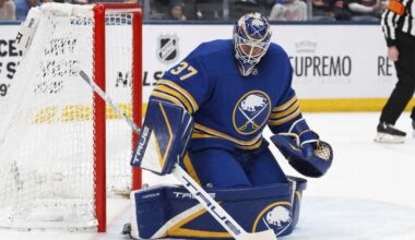 Connor Hellebuyck wearing a Buffalo Sabres home uniform and matching goalie equipment amid trade rumors involving the Winnipeg Jets.