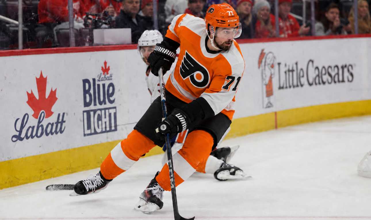Dylan Larkin wearing a Philadelphia Flyers home jersey amid trade speculation involving the Detroit Red Wings