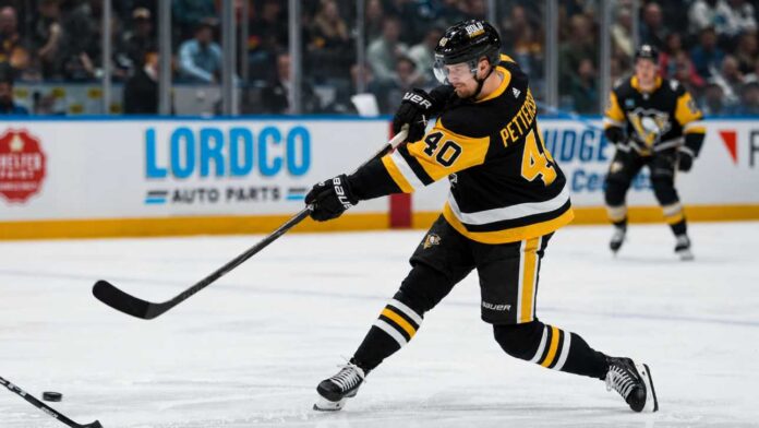 Elias Pettersson wearing a Pittsburgh Penguins home jersey while taking a powerful shot during an NHL game