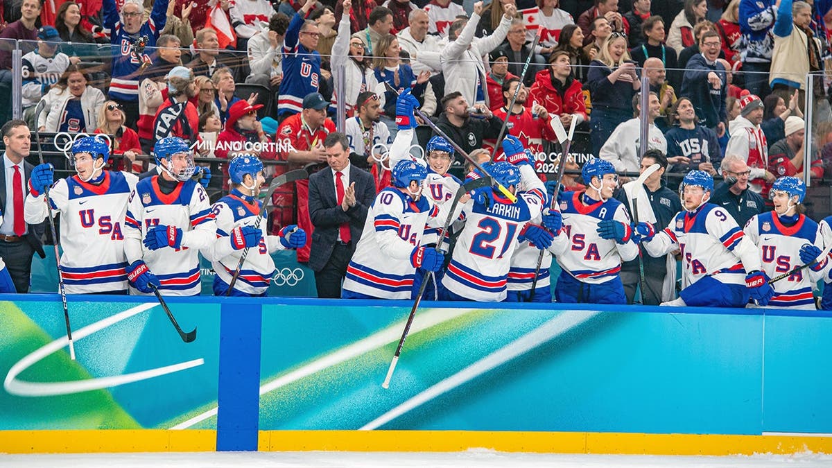 Team USA men celebrate together.