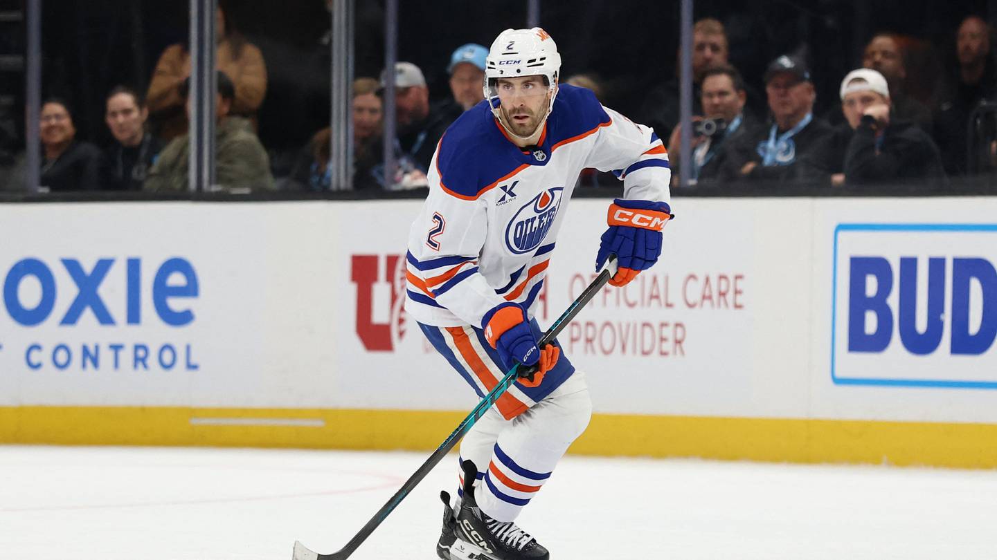 Apr 7, 2026; Salt Lake City, Utah, USA; Edmonton Oilers defenseman Evan Bouchard (2) skates with the puck against the Utah Mammoth during overtime at Delta Center. Mandatory Credit: Rob Gray-Imagn Images