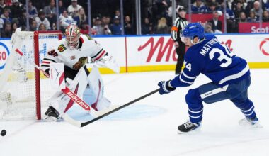 Dec 16, 2025; Toronto, Ontario, CAN; Toronto Maple Leafs center Auston Matthews (34) tries to play the puck in front of Chicago Blackhawks goaltender Spencer Knight (30) during the first period at Scotiabank Arena. Mandatory Credit: Nick Turchiaro-Imagn Images