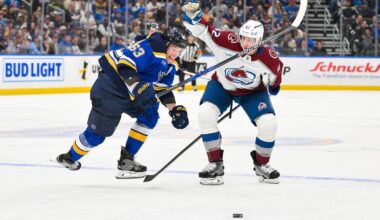 Apr 7, 2026; St. Louis, Missouri, USA; St. Louis Blues left wing Jake Neighbours (63) collides with Colorado Avalanche defenseman Josh Manson (42) as they battle for the puck during the second period at Enterprise Center. Mandatory Credit: Jeff Curry-Imagn Images