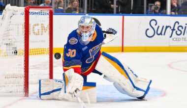Mar 10, 2026; St. Louis, Missouri, USA; St. Louis Blues goaltender Joel Hofer (30) deflects the puck during the third period against the New York Islanders at Enterprise Center. Mandatory Credit: Jeff Curry-Imagn Images