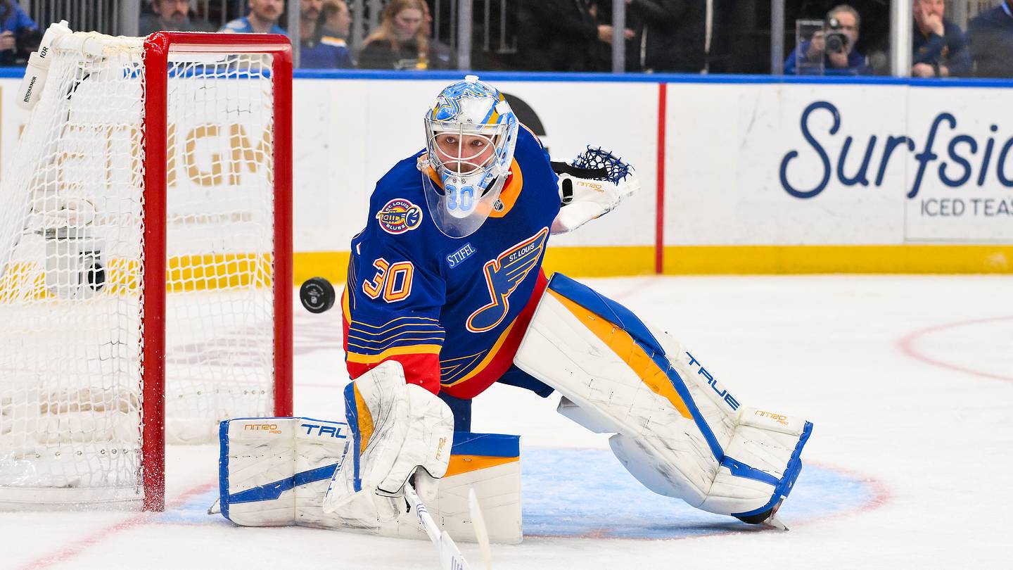 Mar 10, 2026; St. Louis, Missouri, USA; St. Louis Blues goaltender Joel Hofer (30) deflects the puck during the third period against the New York Islanders at Enterprise Center. Mandatory Credit: Jeff Curry-Imagn Images