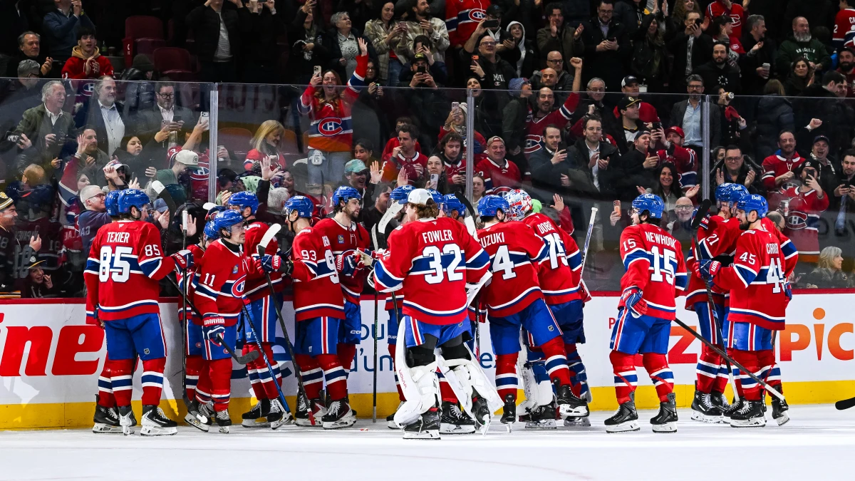 Montreal Canadiens players celebrate their victory over the Boston Bruins after the end of the game at Bell Centre.