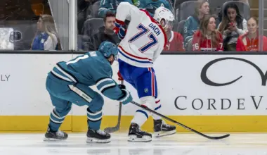 Montreal Canadiens center Kirby Dach (77) controls the puck against San Jose Sharks center Luke Kunin (11) during the first period at SAP Center at San Jose.