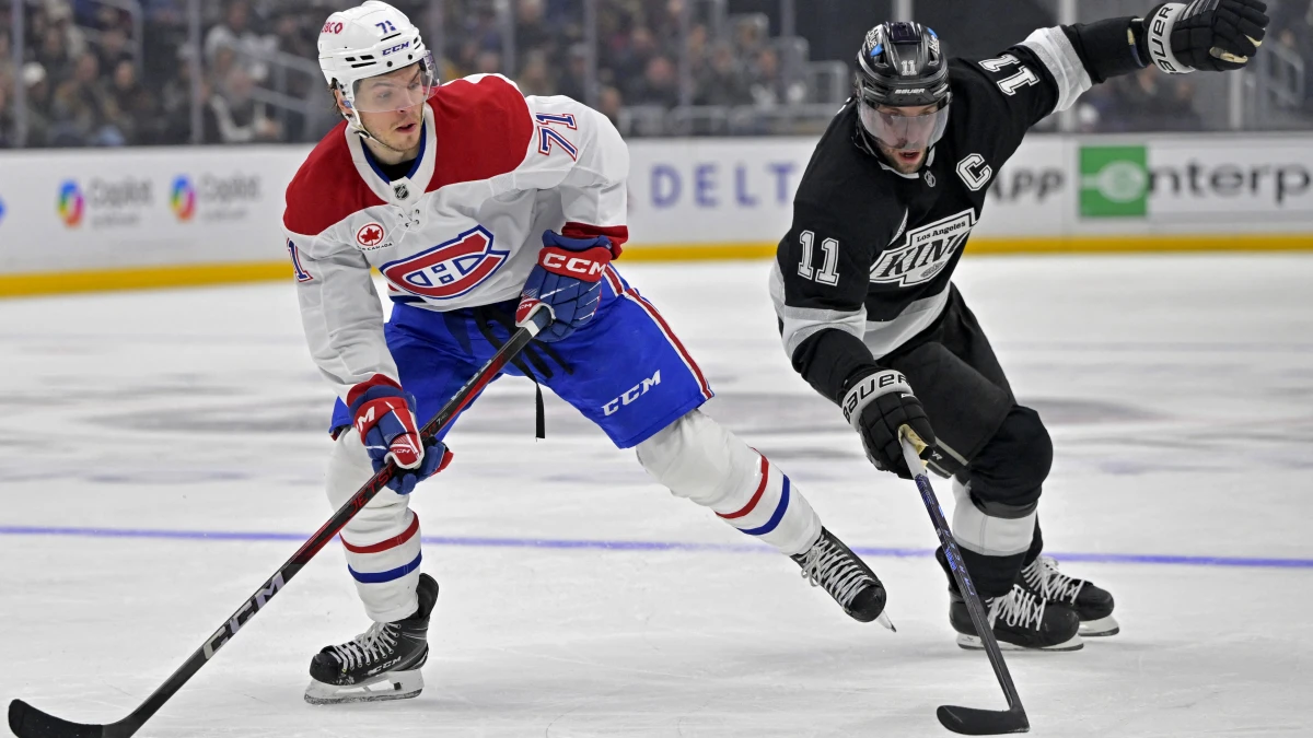 Los Angeles, California, USA;Montreal Canadiens center Jake Evans (71) and Los Angeles Kings center Anze Kopitar (11) chase down the puck in the second period at Crypto.com Arena.