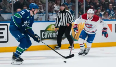 Montreal Canadiens defenseman Lane Hutson (48) defends against Vancouver Canucks forward Filip Chytil (72) in the first period at Rogers Arena.