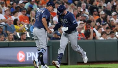 Tampa Bay Rays' Liam Hicks, right, is greeted by third base coach Brady Williams (4) as he runs the bases after hitting a home run off Baltimore Orioles pitcher Brandon Young during the second inning of baseball game in Baltimore, Saturday, Aug. 22, 2026. (AP Photo/Terrance Williams)