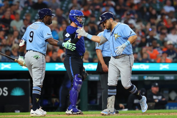 DETROIT, MICHIGAN - AUGUST 24: Jonathan Aranda #8 of the Tampa Bay Rays celebrates his sixth inning solo home run with Jorge Mateo #9 in front of Dillon Dingler #13 of the Detroit Tigers at Comerica Park on August 24, 2026 in Detroit, Michigan. (Photo by Gregory Shamus/Getty Images)