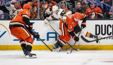 May 10, 2026; Anaheim, California, USA; Anaheim Ducks defenseman Ian Moore (3) and Vegas Golden Knights defenseman Ben Hutton (17) contend for the puck during the third period in game four of the second round of the 2026 Stanley Cup Playoffs at Honda Center. Mandatory Credit: Corinne Votaw-Imagn Images