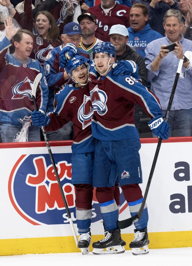 Colorado Avalanche defenseman Sam Malinski (70) celebrates with center Martin Necas (88) after scoring against the Minnesota Wild during the first period in Game 1 of the second round of the NHL Playoffs Sunday, May 3, 2026, at Ball Arena in Denver. (The Gazette, Christian Murdock)