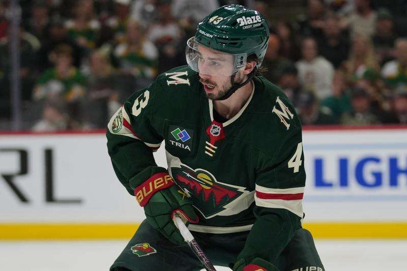 FILE - Minnesota Wild defenseman Quinn Hughes (43) skates with the puck during the second period of Game 3 of an NHL Stanley Cup hockey second-round playoff series against the Colorado Avalanche Saturday, May 9, 2026, in St. Paul, Minn. (AP Photo/Abbie Parr, File)