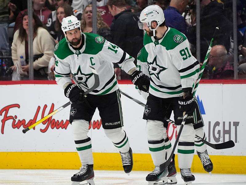 FILE - Dallas Stars left wing Jamie Benn, left, is congratulated by center Tyler Seguin for a goal against the Colorado Avalanche during the third period of Game 6 of an NHL hockey playoff series, May 17, 2024, in Denver. (AP Photo/David Zalubowski, File)