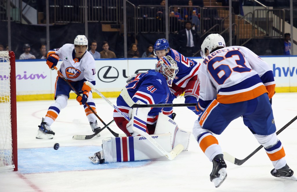Matias Maccelli (63) of the New York Islanders scores a game-winning goal against Spencer Martin (41) of the New York Rangers.