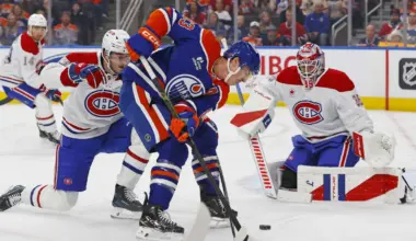Montreal Canadiens defensemen Noah Dobson (53) knocks a puck away from Edmonton Oilers forward Ryan Nugent-Hopkins (93) during the first period at Rogers Place.