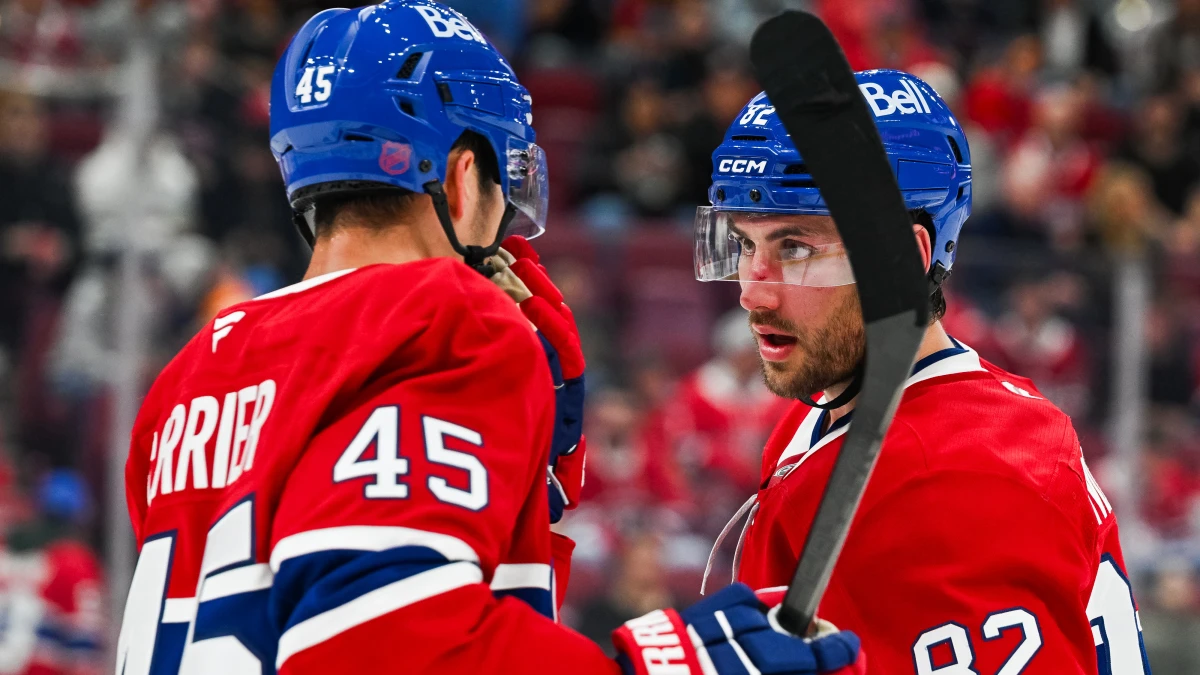 Montreal Canadiens defenseman Alexandre Carrier (45) has a discussion with left wing Lucas Condotta (82) against the Toronto Maple Leafs during the first period at Bell Centre.