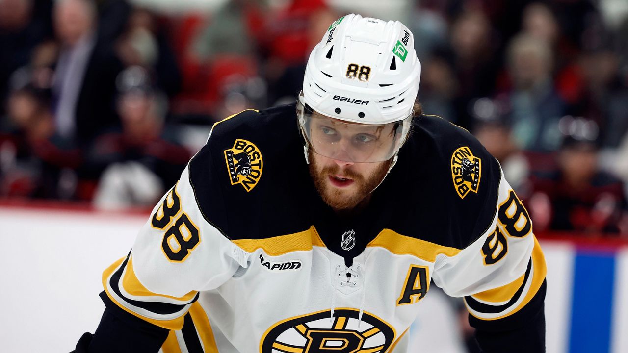 Boston Bruins' David Pastrnak (88) watches during the first period of an NHL hockey game against the Carolina Hurricanes  in Raleigh, N.C., Thursday, March 6, 2025. (AP Photo/Karl DeBlaker, File)