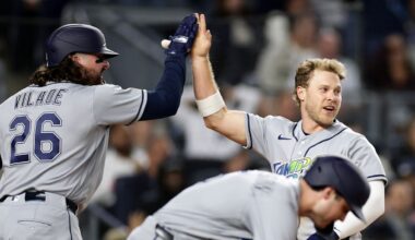 Tampa Bay Rays' Taylor Walls celebrates scoring with Ryan Vilade (26) in the seventh inning during the second baseball game of a doubleheader against the New York Yankees, Tuesday, Sept. 22, 2026, in New York. (AP Photo/Adam Hunger)