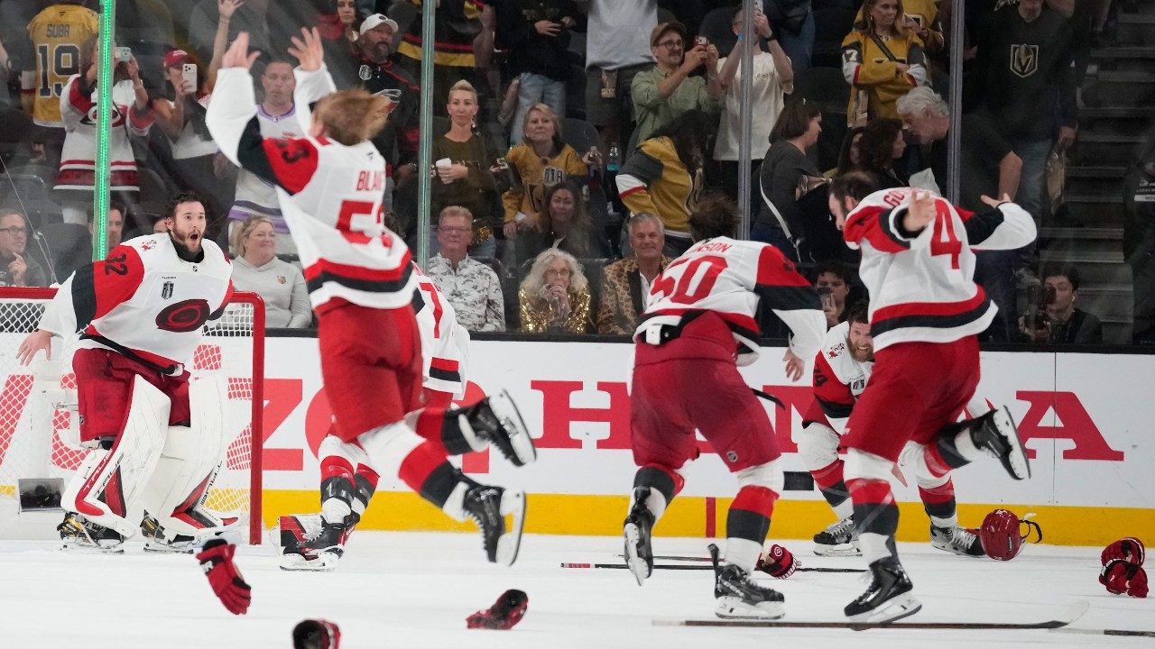 The Carolina Hurricanes celebrate after a win over the Vegas Golden Knights in Game 6 of the NHL hockey Stanley Cup Final series against the Vegas Golden Knights, Sunday, June 14, 2026, in Las Vegas. (AP Photo/John Locher)
