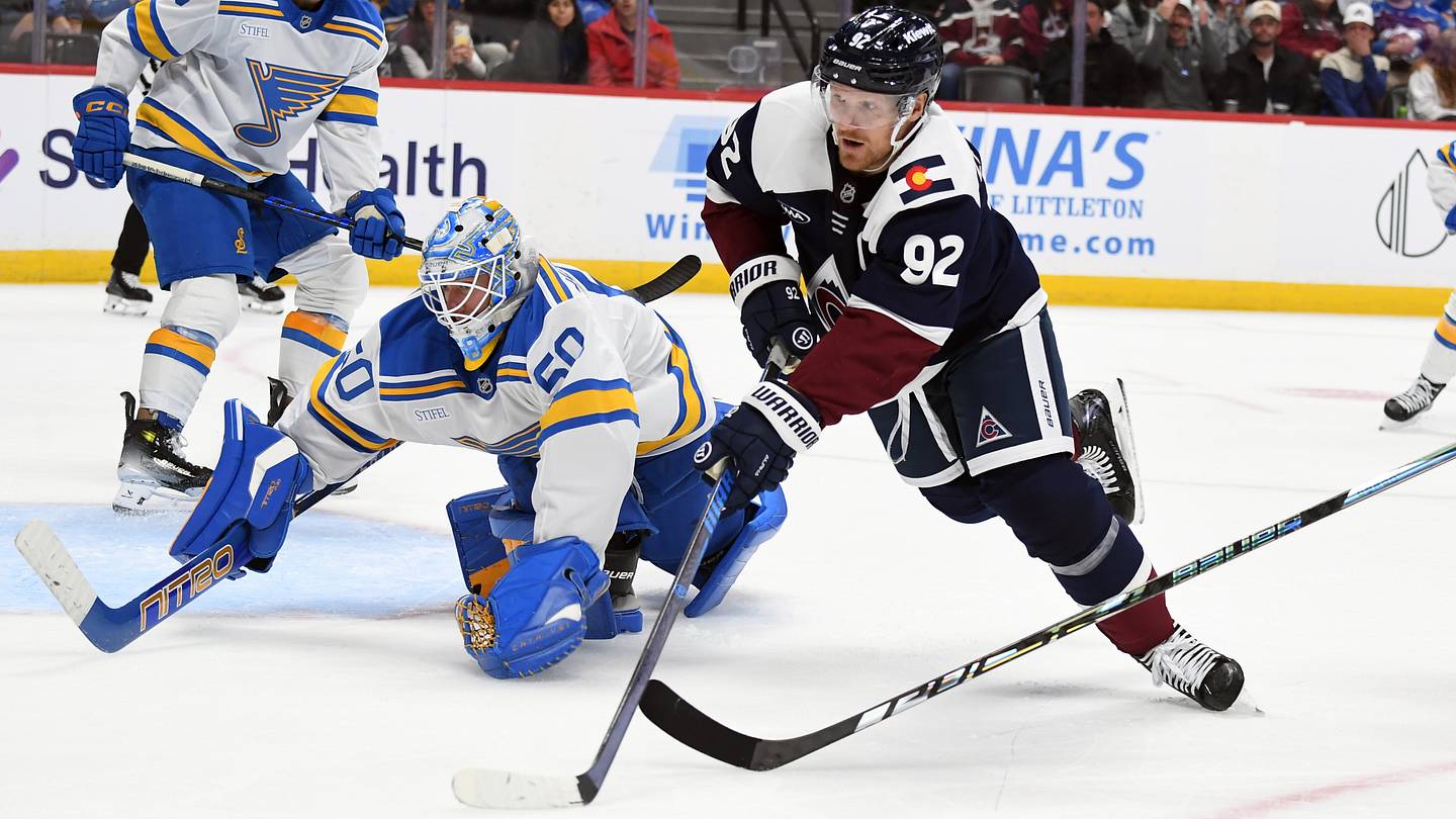 Oct 3, 2026; Denver, Colorado, USA; Colorado Avalanche left winger Gabriel Landeskog (92) works against St. Louis Blues goalie Jordan Binnington (50) for a loose puck during the second period at Ball Arena. Mandatory Credit: Christopher Hanewinckel-Imagn Images