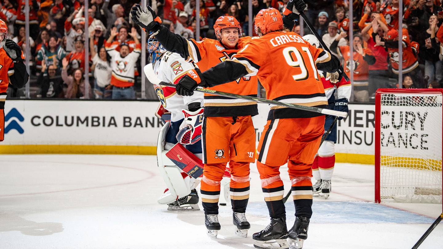 Oct 4, 2026; Anaheim, California, USA;  Anaheim Ducks center Mikael Granlund (64) and center Leo Carlsson (91) celebrate a win in overtime against the Florida Panthers at Honda Center.  Mandatory Credit: Corinne Votaw-Imagn Images