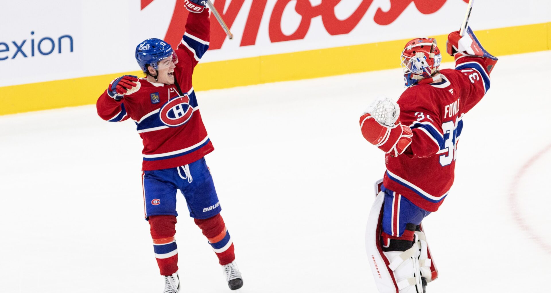 Winger Cole Caufield and Jacob Fowler celebrate the Canadiens' shootout victory over the Detroit Red Wings in Montreal on Saturday.