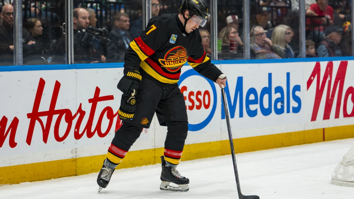 Vancouver Canucks forward Brendan Gallagher (7) picks up his stick during a stop in play against the Calgary Flames in the second period at Rogers Arena.