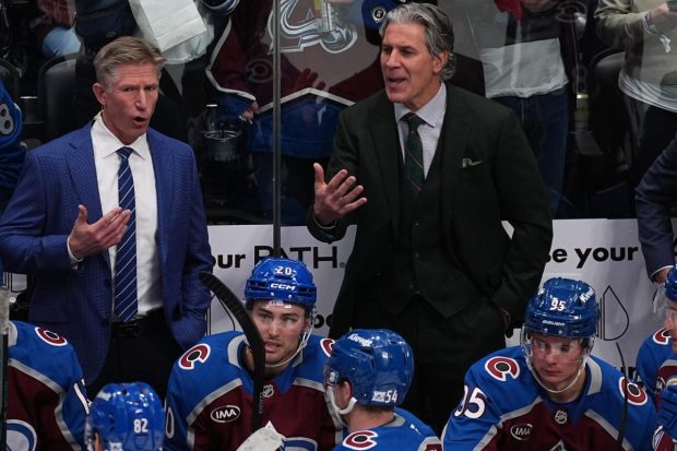 Colorado Avalanche assistant coach Dave Hakstol, left, and head coach Jared Bednar dispute a call in the third period of an NHL hockey game Thursday, Jan. 8, 2026, in Denver. (AP Photo/David Zalubowski)