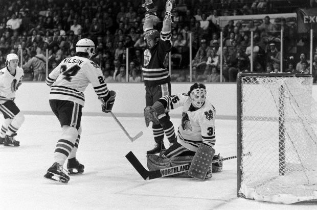 Edmonton Oilers phenom Wayne Gretzky (99) signals a goal against the Chicago Blackhawks on Oct. 10, 1979, at the Chicago Stadium. It was Gretzky's first NHL game and also the Oilers' NHL debut. Gretzky was given an assist on Keith Lowe's goal on a powerplay. The Hawks won 4-2. (Ed Wagner Jr./Chicago Tribune)