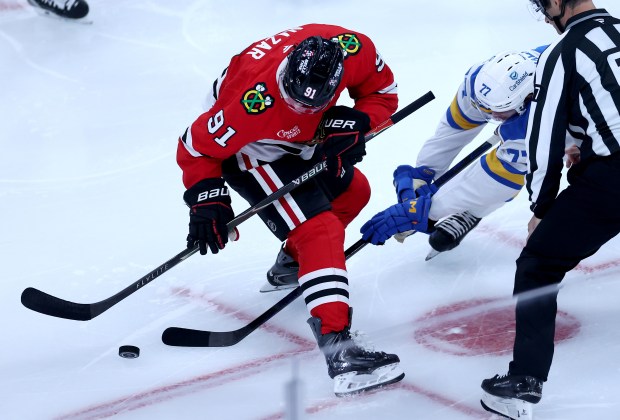 Chicago Blackhawks center Frank Nazar (91) and St. Louis Blues left wing Connor McMichael (77) battle in the second period of the Blackhawks home opener at the United Center in Chicago on Oct. 6, 2026. (Chris Sweda/Chicago Tribune)
