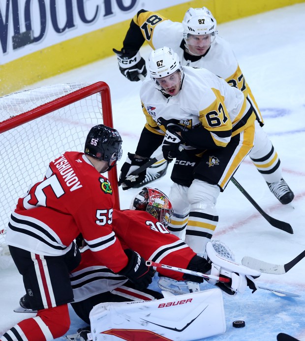 Chicago Blackhawks goaltender Spencer Knight (30) tries to make a save in the second period of a game against the Pittsburgh Penguins at the United Center in Chicago on Oct. 13, 2026. (Chris Sweda/Chicago Tribune)