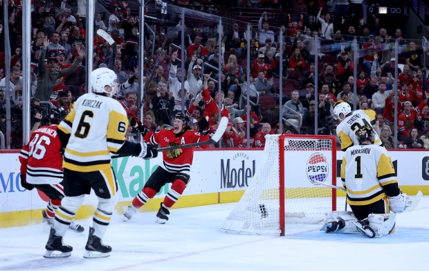 Chicago Blackhawks left wing Tyler Bertuzzi (59) celebrates with center Teuvo Teravainen (86) after Teravainen scored a goal in the third period of a game against the Pittsburgh Penguins at the United Center in Chicago on Oct. 13, 2026. (Chris Sweda/Chicago Tribune)