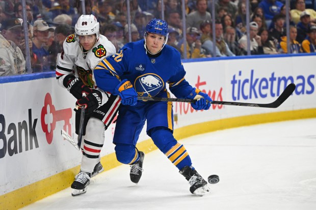 Hawks forward Patrick Kane, left, battles the Sabres' Jiri Kulich along the boards during the third period Saturday, Oct. 3, 2026, in Buffalo, N.Y. The Hawks lost 4-3. (Joe Hrycych/Getty)
