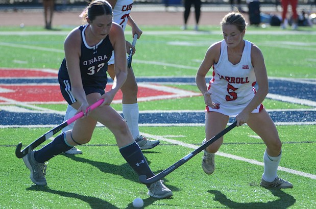 Cardinal O'Hara's Catie Doogan tries to dribble past Archbishop Carroll's Morgan Wood Wednesday afternoon. The Patriot's went on to a 4-2 victory. (PETE BANNAN/MediaNews Group)