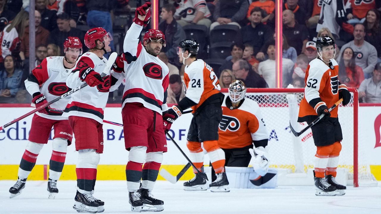 Shayne Gostisbehere celebrates after scoring the game-winning goal during overtime in an NHL hockey game against the Philadelphia Flyers on Saturday, Oct. 3, 2026, in Philadelphia. (AP Photo/Matt Slocum)