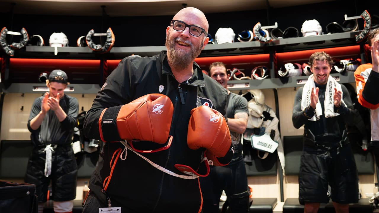 Flyers head coach Tocchet gives game puck to radio broadcaster Myrtetus
