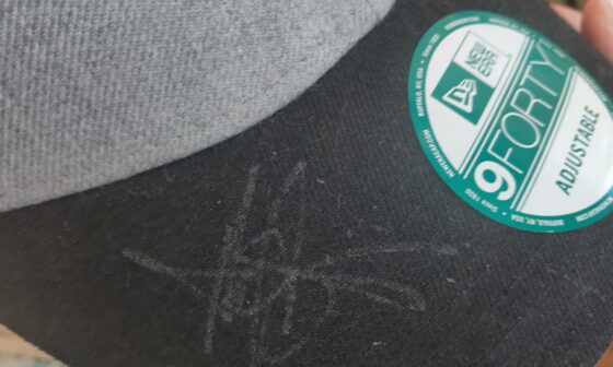 Someone I know has an autographed hat, but we have no idea who it is. Can someone help us identity it?