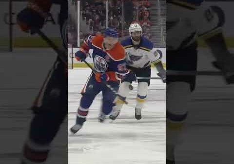 McDavid carries the puck into the zone McDavid-style