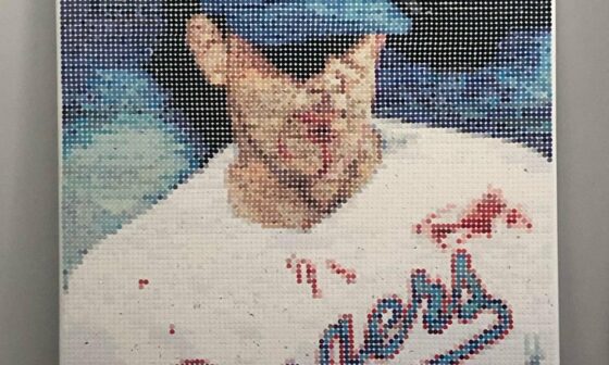 Made a picture of Nolan Ryan using old baseball cards and a hole punch. It got removed from r/baseball for fan art so I thought you guys would appreciate it.