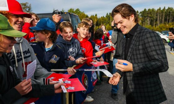 Cole Caufield signing autographs for kids in Gander, Newfoundland