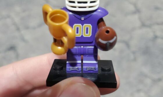 Picked this little guy up at a local convention to add to my mini figure collection, Here's hoping the trophy he's holding is a 3rd Lombardi sooner then later, as fan of Lego and the Ravens it's a fun thing to have